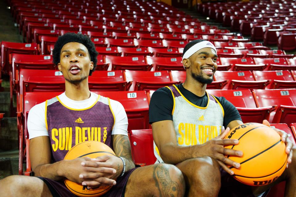 Desmond Cambridge Jr. (left), and his brother, Devan Cambridge (right) watch their teammates from the stands of Desert Financial Arena on Oct 20, 2022, in Tempe, AZ.