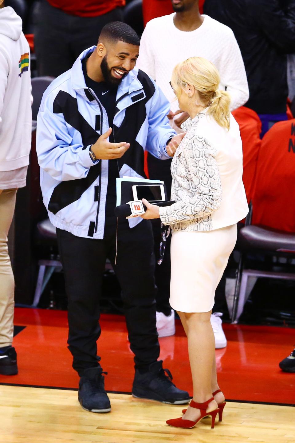 Drake chats with TV personality Doris Burke before game five of the 2019 NBA Finals between the Toronto Raptors and the Golden State Warriors at Scotiabank Arena on Monday in Toronto.