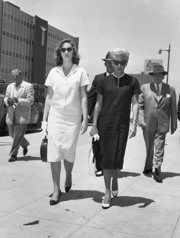 <p>Bettmann/Getty</p> Cheryl Crane (left) and Lana Turner in 1958