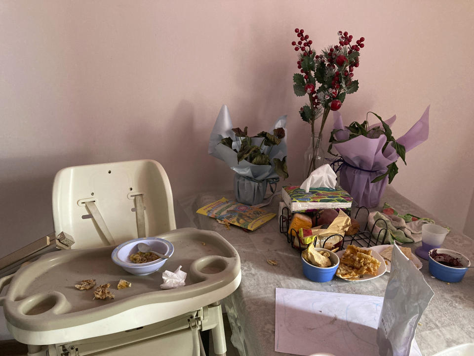 A child’s breakfast sits abandoned for weeks in a war-damaged apartment in Irpin, Ukraine, on Monday, April 11, 2022. Heartened by Russia’s withdrawal from the capital region, some residents have been coming to what’s left of home. (AP Photo/Cara Anna)