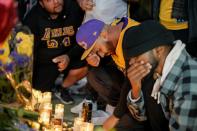 Mourners gather in Microsoft Square near the Staples Center to pay respects to Kobe Bryant after a helicopter crash killed the retired basketball star, in Los Angeles