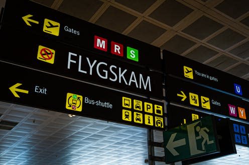 <span class="caption">Flygskam, or "flight shame," has done little to counteract the effects of air travel. </span> <span class="attribution"><a class="link " href="https://www.shutterstock.com/image-photo/information-panel-flygskam-word-on-international-1489269719" rel="nofollow noopener" target="_blank" data-ylk="slk:Ivan Marc/ Shutterstock;elm:context_link;itc:0;sec:content-canvas">Ivan Marc/ Shutterstock</a></span>