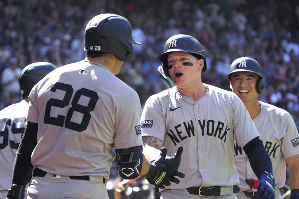 New York Yankees' Alex Verdugo celebrates with Austin Wells (28) after hitting a two-run home run against the Arizona Diamondbacks during the 10th inning of a baseball game Wednesday, April 3, 2024, in Phoenix. (AP Photo/Rick Scuteri)