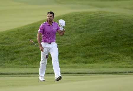 Jun 19, 2016; Oakmont, PA, USA; Jason Day waves to the gallery as he walks to the 18th green during the final round of the U.S. Open golf tournament at Oakmont Country Club. Mandatory Credit: Michael Madrid-USA TODAY Sports