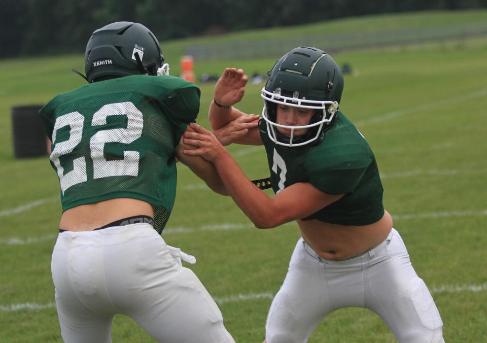 Christian Ulrey maneuvers past Cameron Brannigan in a shedding drill during a Northridge football team camp on Wednesday, July 26, 2023.