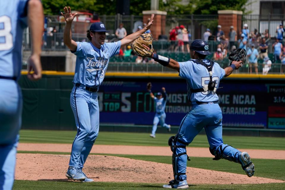 North Carolina reliever Davis Palermo embraces catcher Tomas Frick, right, as the Tar Heels celebrate defeating NC State in the ACC baseball tournament championship game on Sunday at Truist Field in Charlotte.