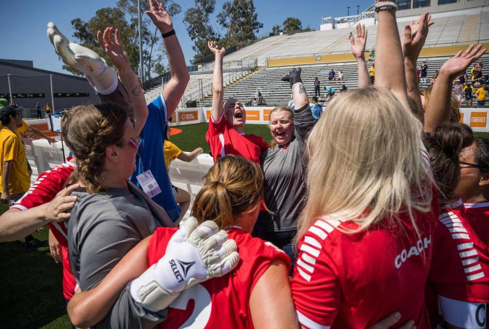 The Norway women’s team lets out a yell before taking on France on opening day of soccer at the 18th Homeless World Cup on Saturday at Sacramento State’s Hornet Stadium. The event, first held in 2003, is being hosted in the United States for the first time this year following a hiatus during the COVID-19 pandemic.