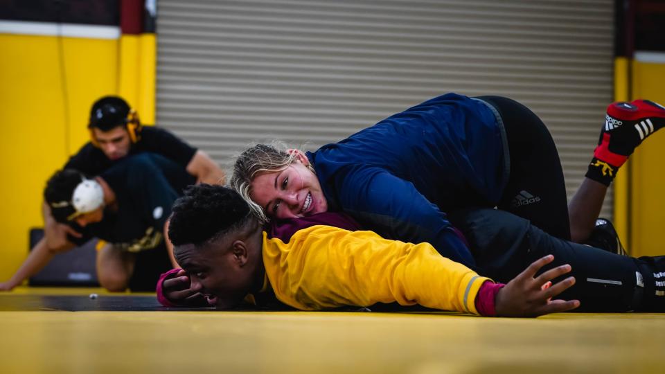 ASU wrestler Marlee Smith practices on the mat with teammate Jacori Teemer.