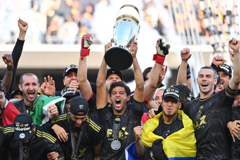 Los Angeles FC players celebrate with the Philip F. Anschutz Trophy after defeating the Philadelphia Union in the 2022 MLS Cup championship game at Banc of California Stadium.