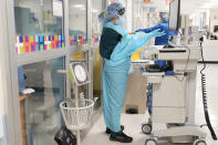 Medical personnel don PPE while attending to a patient (not infected with COVID-19) at Bellevue Hospital in New York, Wednesday, Oct. 28, 2020. Hospitals in the city's public NYC Health and Hospitals' system have been upgrading their equipment, bracing for a potential resurgence of coronavirus patients, drawing on lessons learned in the spring when the outbreak brought the nation's largest city to its knees. (AP Photo/Seth Wenig)