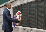 US President Barack Obama lays a wreath at the Memorial Park in Nairobi on July 25, 2015, commemorating the August 7, 1998 bombing of the US Embassy, which killed more than 218 Americans and Kenyans, and injured more than 5,000 people