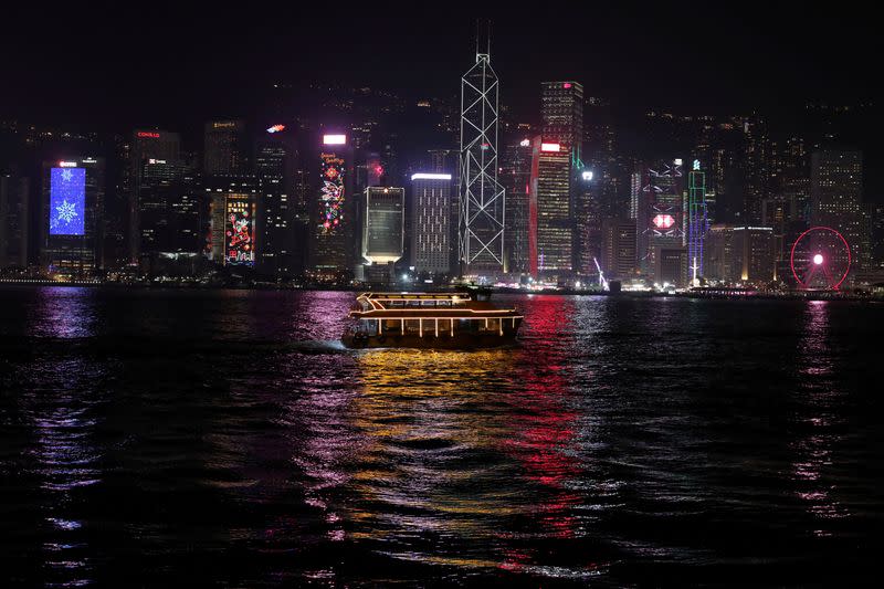 FILE PHOTO: The Hong Kong skyline is lit up on Christmas Eve in Hong Kong