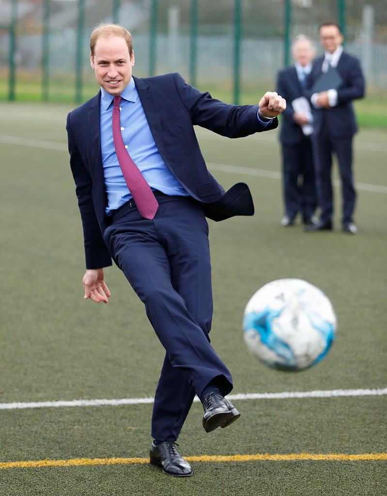 5) Prince William and Prince Harry play football.