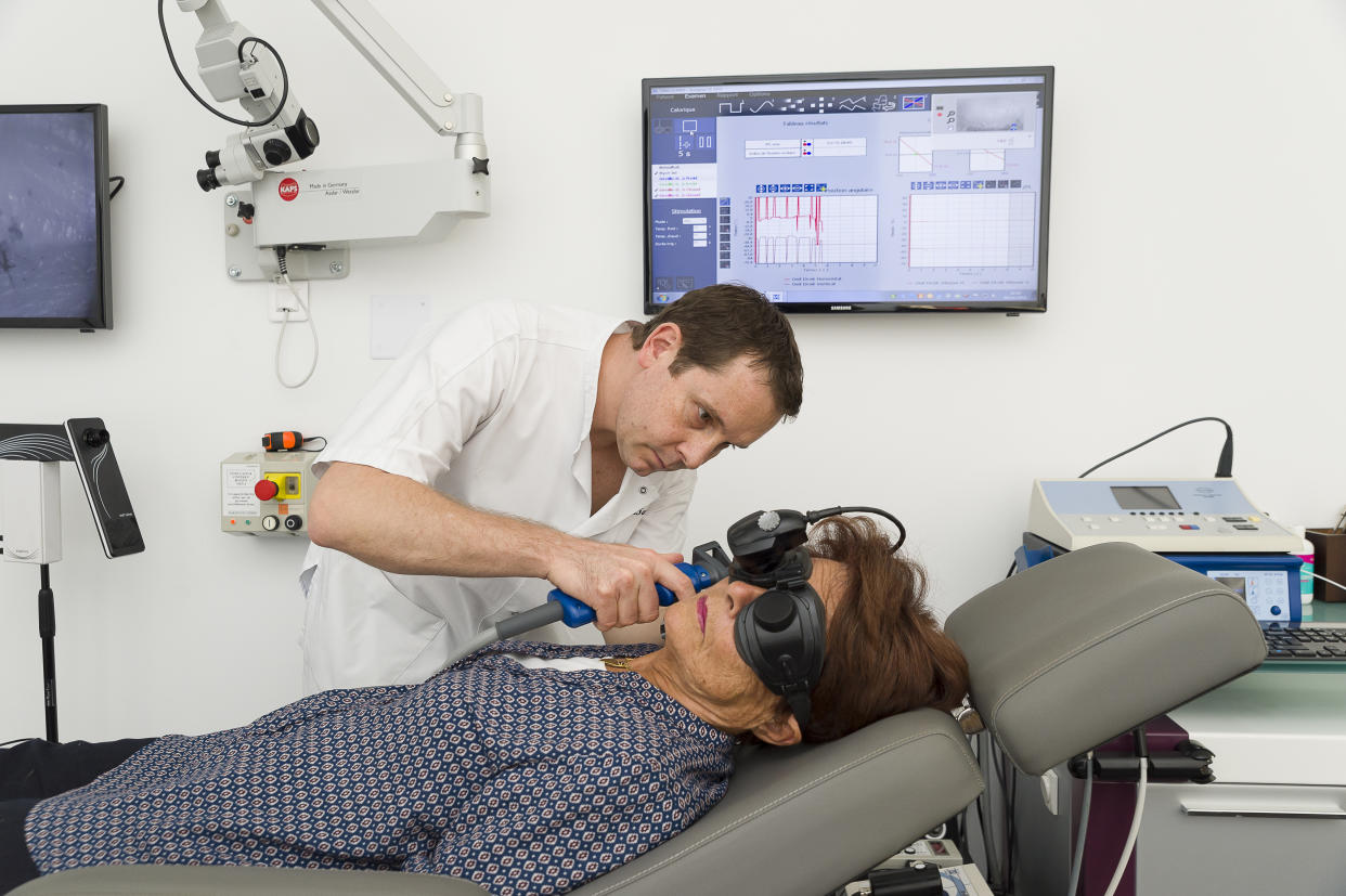 ENT doctor treating patients suffering from dizziness, Nice France, Caloric tests involving blowing air into the ear. Hot and cold air generates a response in inner ear through a modification in eye movement. (Photo by: BSIP/Universal Images Group via Getty Images)