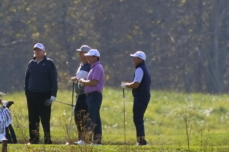 President Donald Trump participates in a round of golf at the Trump National Golf Course on Saturday, Nov. 7, 2020, in Sterling, Va. (AP Photo/Patrick Semansky)