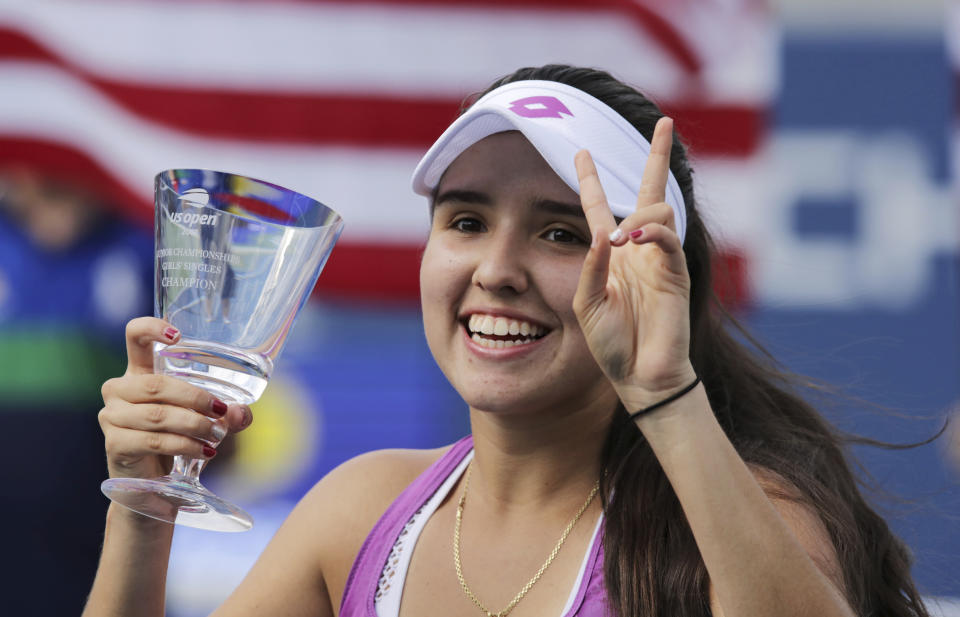 Maria Camila Osorio Serrano, of Colombia, holds up the trophy after defeating Alexandra Yepinfanova, of the United States, in the junior girl's singles final of the U.S. Open tennis championships Sunday, Sept. 8, 2019, in New York. (AP Photo/Charles Krupa)