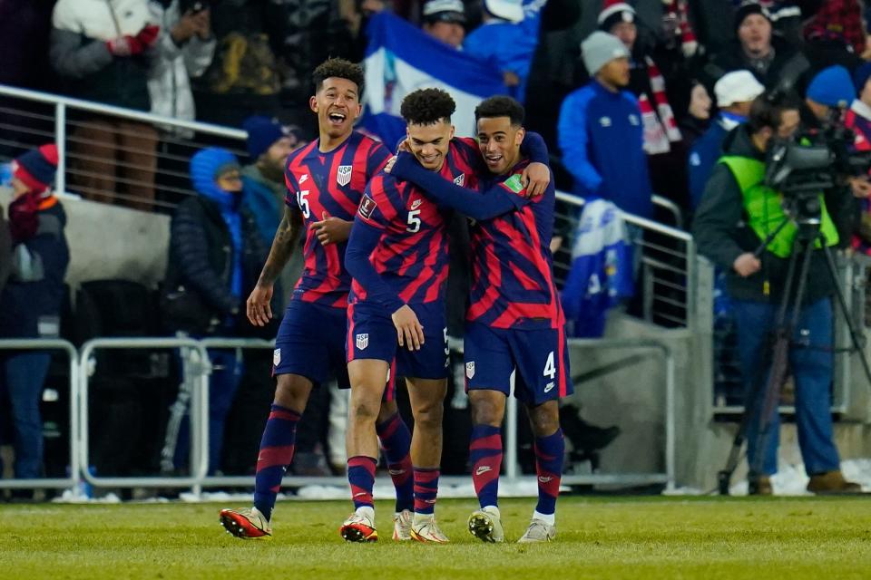 Antonee Robinson (5) celebrates his goal with teammates Chris Richards (15) and Tyler Adams (4).