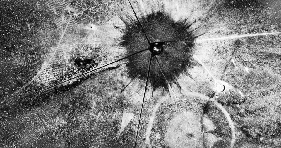 FILE - This July 16, 1945, file photo, shows an aerial view after the first atomic explosion at Trinity Test Site, N.M. Western governors say atmospheric nuclear weapons testing exposed more states and more people to radiation fallout and resulting cancers and other diseases than the federal government recognizes. The Western Governors' Association on Friday, Oct. 11, 2019, sent letters to the U.S. Senate and U.S. House urging passage of proposed changes to a law involving "downwinders" that would add all of Nevada, Arizona and Utah, and include for the first time downwinders in Colorado, Idaho, Montana, New Mexico and the island territory of Guam. (AP Photo/File)