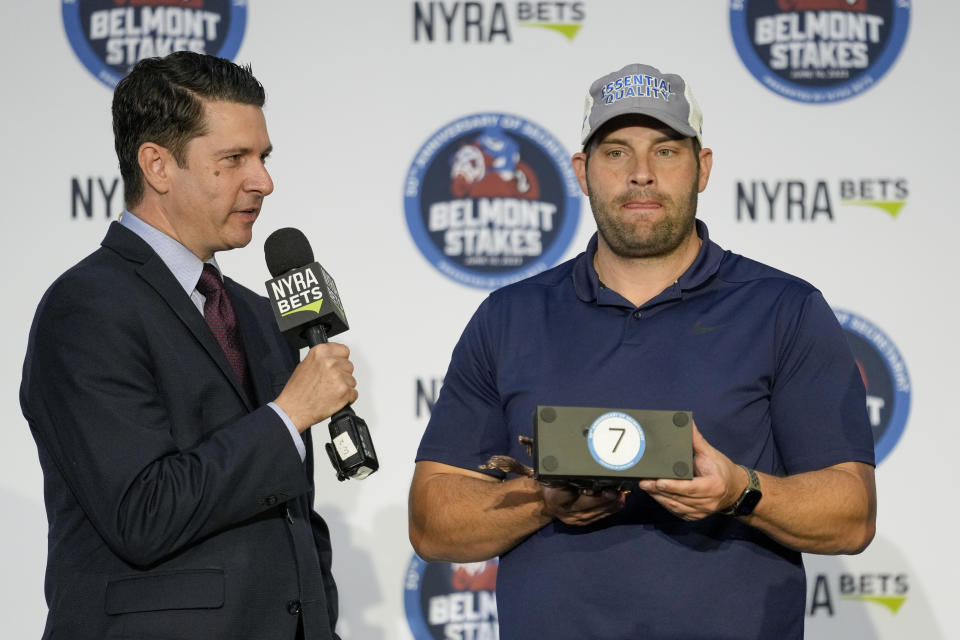 Trainer Brad Cox randomly selects seventh position for his entrant Hit Show during a drawing for post positions ahead of the Belmont Stakes horse race, Tuesday, June 6, 2023, at Belmont Park in Elmont, N.Y. (AP Photo/John Minchillo)