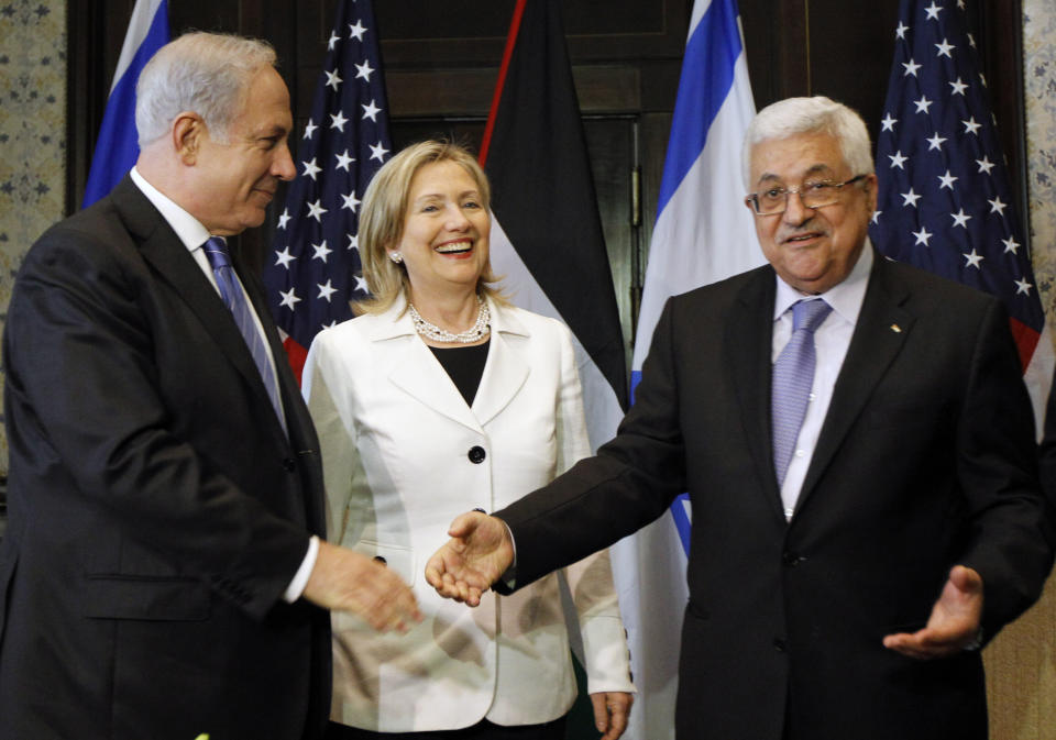 FILE - In this Sept. 14, 2010 file photo, Israeli Prime Minister Benjamin Netanyahu, left, US Secretary of State Hillary Rodham Clinton, and Palestinian President Mahmoud Abbas, meet in Sharm El-Sheikh, Egypt. As Netanyahu becomes Israel’s longest-serving prime minister, he is solidifying his place as the country’s greatest political survivor and the most dominant force in Israeli politics in his generation.(AP Photo/Alex Brandon, Pool, File)