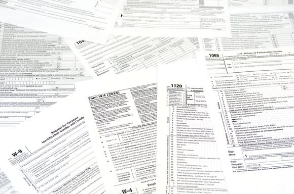 Pile of various tax forms spread out.