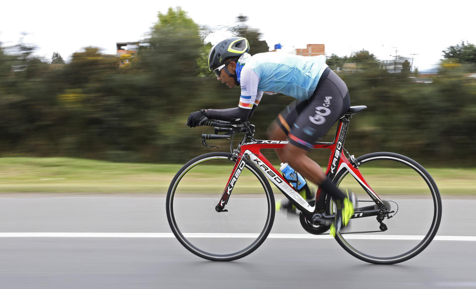 Jonathan Bustamante, of the Esteban Chaves Foundation cycling team, takes part in a time trial training session in Puente Piedra near in Bogota, Colombia, Friday, Sept. 13, 2019. In the weeks since Egan Bernal became the first Colombian to win the Tour de France, the country has been basking in attention focused on its reputation for churning out specialist climbers raised on thin mountain air and possessing the sort of superhuman stamina taught by poverty. (AP Photo/Fernando Vergara)