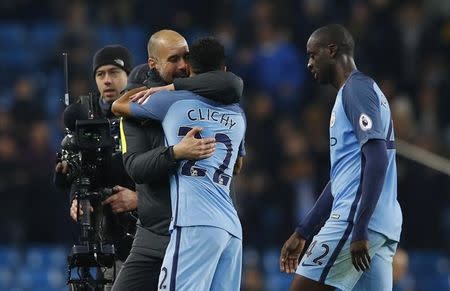 Britain Football Soccer - Manchester City v Arsenal - Premier League - Etihad Stadium - 18/12/16 Manchester City manager Pep Guardiola celebrates with Gael Clichy at the end of the match Reuters / Phil Noble Livepic