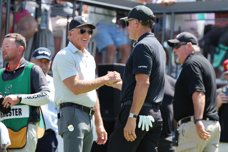 Greg Norman greats Phil Mickelson on the first tee during the final round of the LIV Golf Bedminster golf tournament at Trump National Bedminster. Mandatory Credit: Vincent Carchietta-USA TODAY Sports