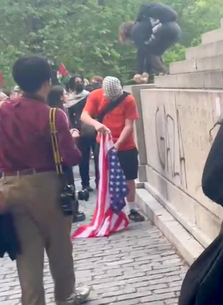 The protester, whose face was covered, was caught on camera. Jack Morphet/NY Post