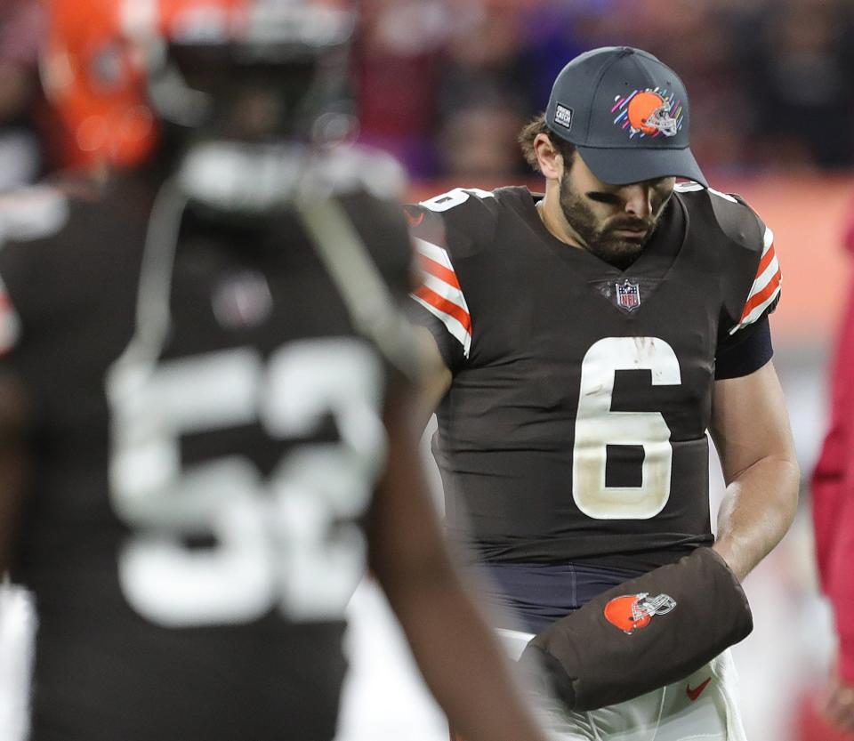 Cleveland Browns quarterback Baker Mayfield (6) hangs his head as he walks off the field following a 37-14 loss to the Arizona Cardinals in an NFL football game at FirstEnergy Stadium, Sunday, Oct. 17, 2021, in Cleveland, Ohio. [Jeff Lange/Beacon Journal]