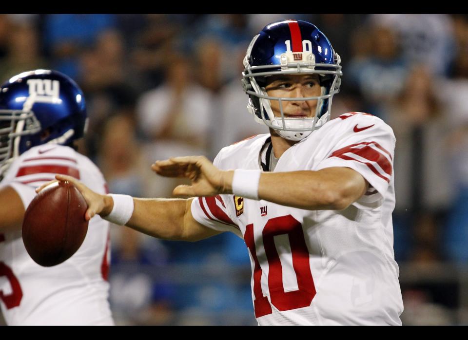 New York Giants quarterback Eli Manning (10) throws against the Carolina Panthers during the first quarter of an NFL football game in Charlotte, N.C., Thursday, Sept. 20, 2012. 