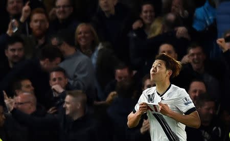 Britain Football Soccer - Chelsea v Tottenham Hotspur - Barclays Premier League - Stamford Bridge - 2/5/16 Tottenham's Heung Min Son celebrates scoring their second goal Reuters / Dylan Martinez Livepic EDITORIAL USE ONLY. No use with unauthorized audio, video, data, fixture lists, club/league logos or "live" services. Online in-match use limited to 45 images, no video emulation. No use in betting, games or single club/league/player publications. Please contact your account representative for further details.