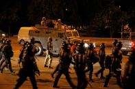 Clashes with opposition supporters after polls closed at the presidential election in Minsk