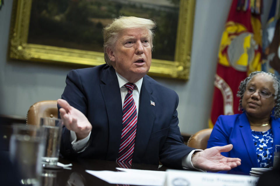 Barb Smith, President, Journey Steel, Inc., right, listens President Donald Trump speaks during a small business roundtable in the Roosevelt Room of the White House, Friday, Dec. 6, 2019, in Washington. (AP Photo/ Evan Vucci)