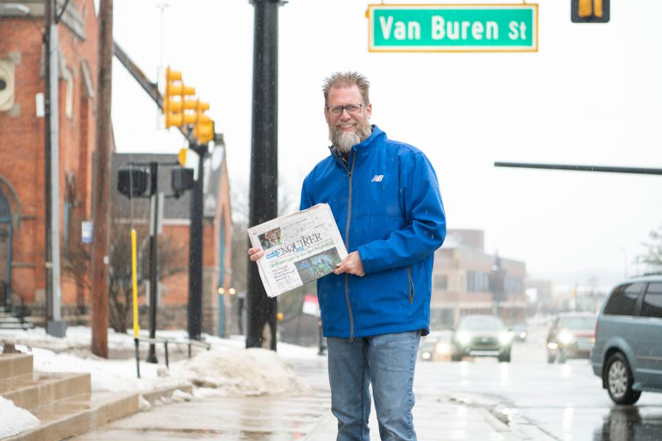 Battle Creek resident Bob Reichel with newspapers for sale on the corner of Capital Avenue and Van Buren Street on Wednesday, Jan. 24, 2024.