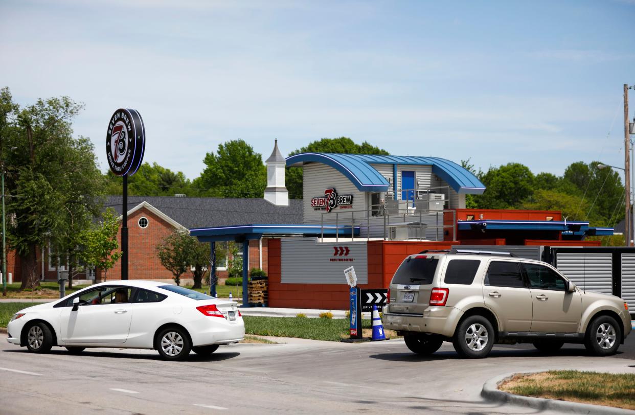 Cars enter and leave the new 7 Brew Coffee at Sunshine Street and Jefferson Avenue on Wednesday, May 1, 2024.