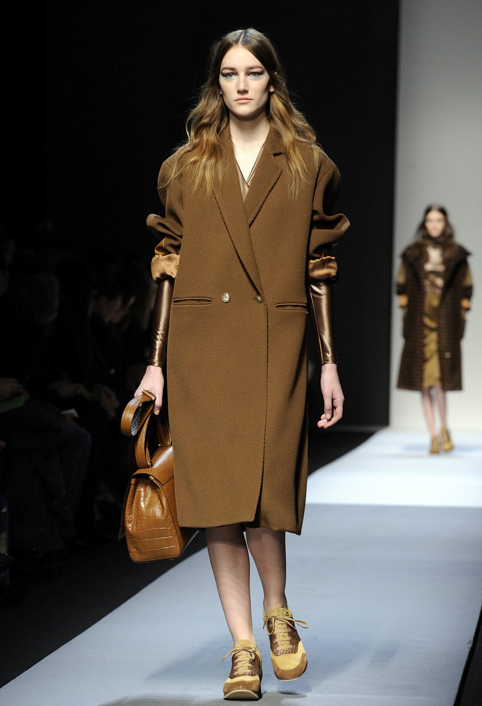 A model wears a creation for Max Mara women's Fall-Winter 2013-14 collection, part of the Milan Fashion Week, unveiled in Milan, Italy, Thursday, Feb. 21, 2013. (AP Photo/Giuseppe Aresu)