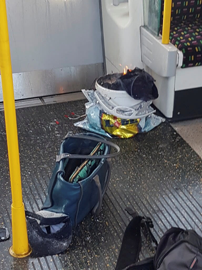 <p>Personal belonglongs and a bucket with an item on fire inside it, are seen on the floor of an underground train carriage at Parsons Green station in West London, Britain, Sept. 15, 2017, in this image taken from social media. (Photo: Sylvain Pennec via Reuters) </p>