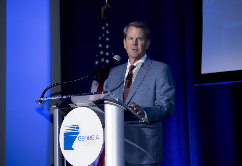 FILE Georgia Gov. Brian Kemp speaks at the Georgia Ports Authority 2022 State of the Port address, Thursday Feb. 24, 2022, in Savannah, Ga. A planned $5 billion electric vehicle plant that has been billed as the largest economic development project in Georgia’s history is drawing opposition from an unusual source: former Republican U.S. senator David Perdue. A former corporate executive, Perdue is looking to unseat Georgia Gov. Kemp, a fellow Republican, in this year’s gubernatorial race. (AP Photo/Stephen B. Morton, File)