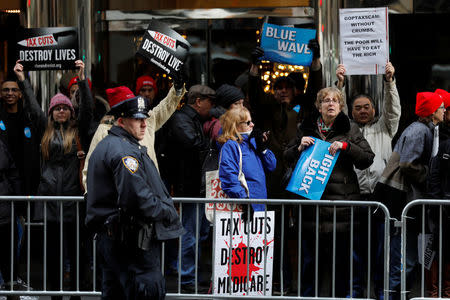 Protesters gather while U.S. President Donald Trump arrives at a fundraising event in New York, U.S., December 2, 2017. REUTERS/Yuri Gripas