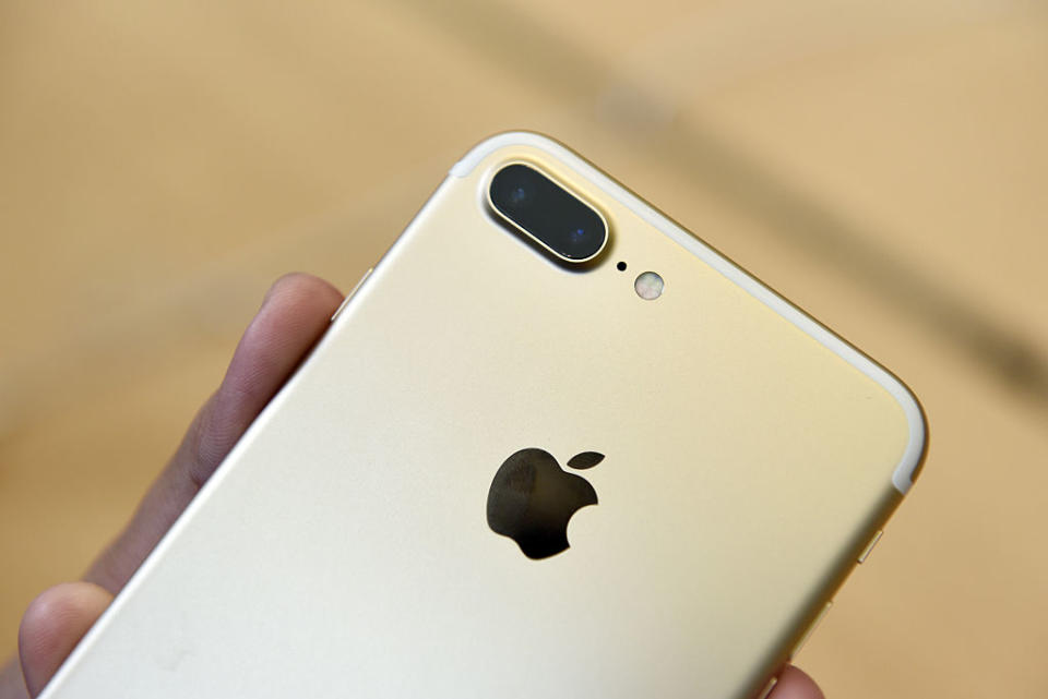 A customer views an iPhone 7 Plus smartphone at an Apple Inc. in San Francisco, California, U.S., on Friday, Sept. 16, 2016. Shoppers looking to buy Apple Inc.'s new iPhone 7 smartphones on Friday better have ordered ahead. Brisk demand left some stores sold out, leaving those who purchased online with the best chance to get their hands on the latest models -- and some resorting to extreme measures. Photographer: Michael Short/Bloomberg via Getty Images