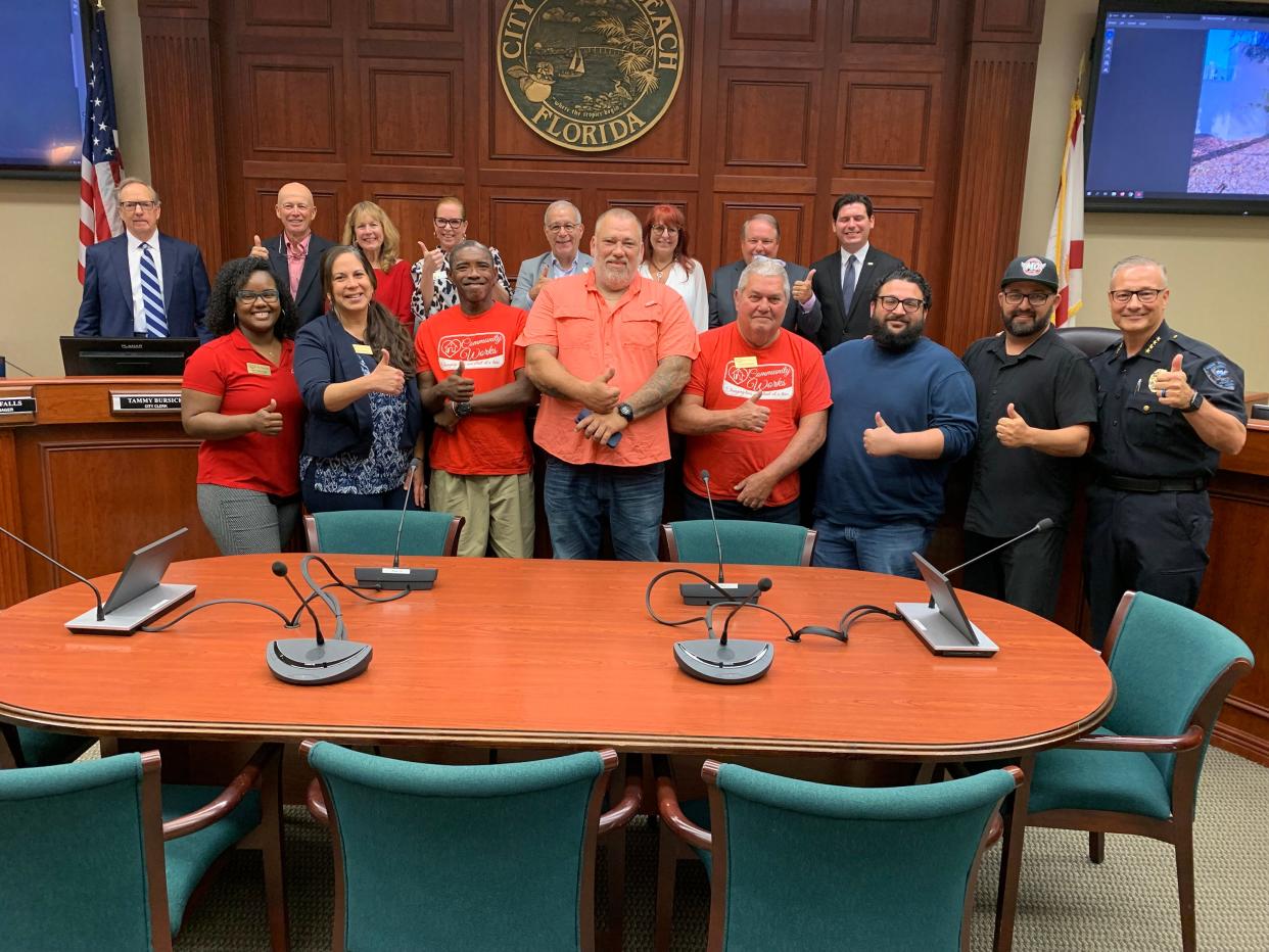 Back row: John Turner, city attorney; Monte Falls, city manager; Tammy Bursick, city clerk; Tracey Zudans, city council member; John Cotugno, mayor; Linda Moore, vice mayor; John Carroll, city council member; and Taylor Dingle, city council member. Front row: Jade Alexander, Brenda Sposato, Kwasi Banks, Kevin Breazeale, Leonard Hamker, Jonathan Orozco, Tony Zorbaugh from The Source; and Police Chief David Currey.