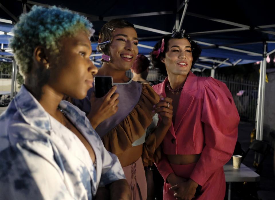 Actors Monet Allen-Kemp, left, Adrian Paul Arroyo and Aris Rahim before going on set.