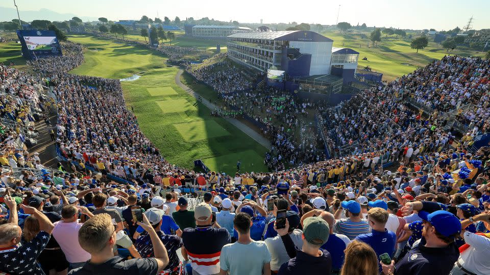 Crowds pack the first tee grandstand to watch McIlroy tee off. - David Cannon/Getty Images