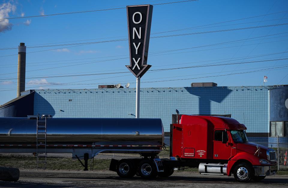 A truck pulls drives past Club Onyx on South Harding Street in Indianapolis.