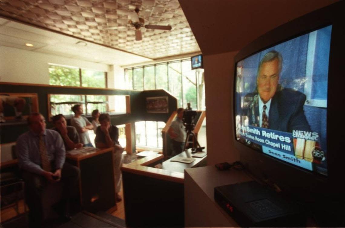 UNC fans watch Dean Smith’s retirement announcement on television at the Four Corners restaurant on Franklin St. in 1997.