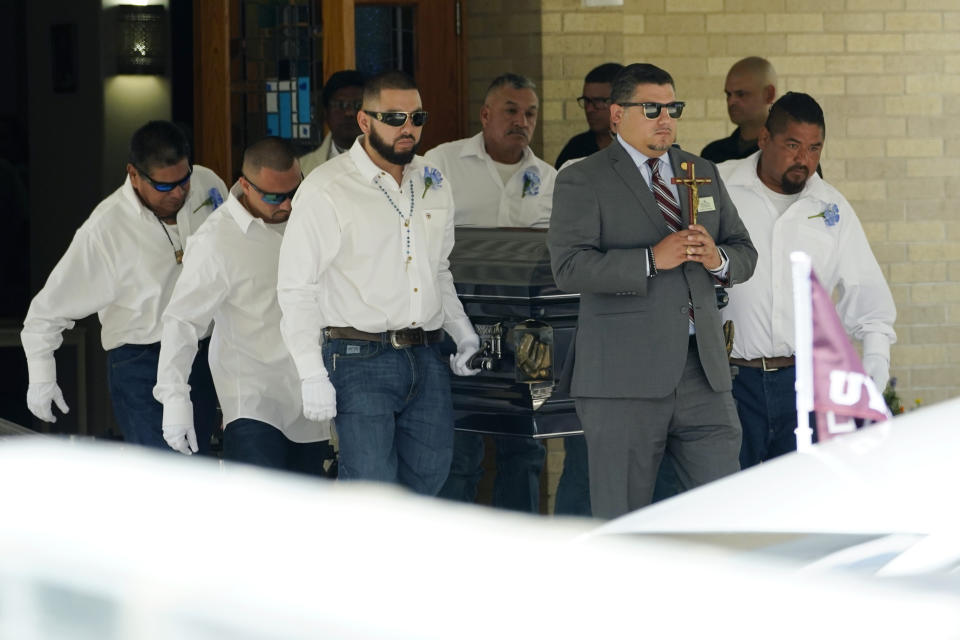 Pallbearers carry the casket of Jose Flores Jr. after a funeral service at Sacred Heart Catholic Church, Wednesday, June 1, 2022, in Uvalde, Texas. Flores was killed in last week's elementary school shooting. (AP Photo/Eric Gay)