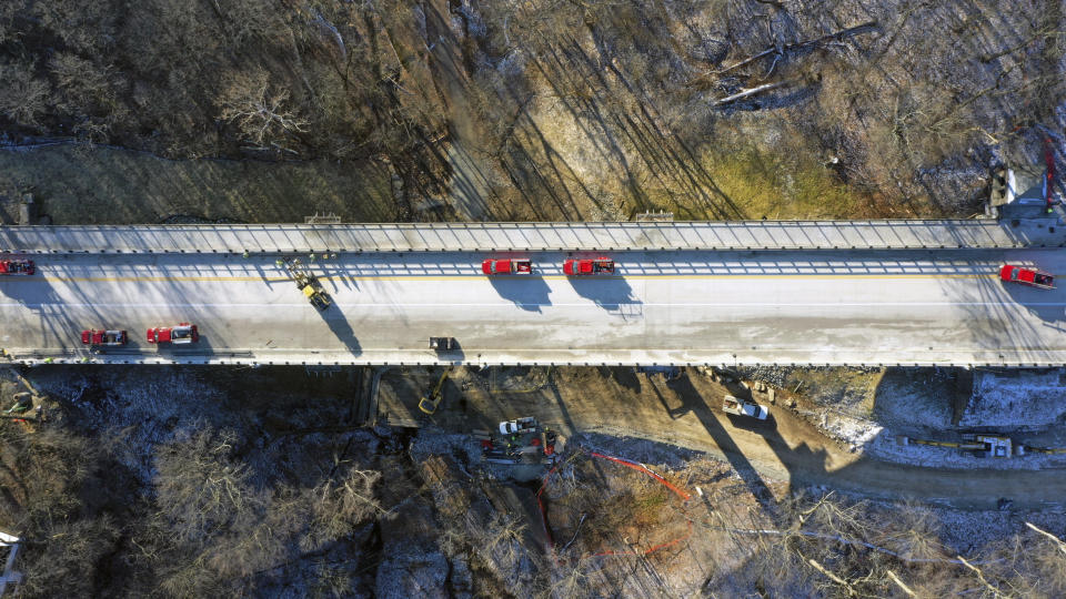 This aerial image taken with a drone, shows the new Fern Hollow Bridge, that is being dedicated Wednesday, Dec. 21, 2022 in Pittsburgh. After the original bridge collapsed into a ravine on Friday, Jan. 28, 2022, the Fern Hollow Bridge became a symbol of the country's troubled infrastructure. (AP Photo/Gene J. Puskar)