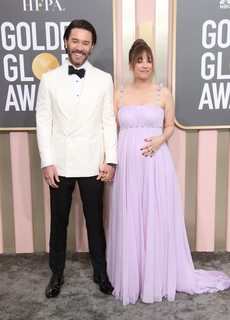 Kaley Cuoco places her hand on her bump, alongside her partner, actor Tom Pelphrey at the Golden Globe Awards on Jan. 10, 2023 in Beverly Hills, Calif. They welcomed daughter Matilda about 2.5 month later.