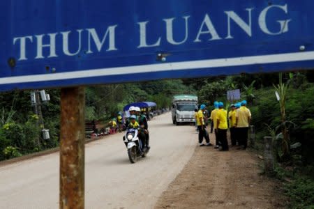 Volunteers arrive to clear the campsite of the rescue mission for the 12 boys of the